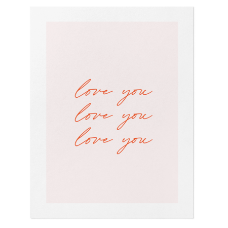 Card with pale pink background and three lines of red cursive 'love you', conveying a loving message.